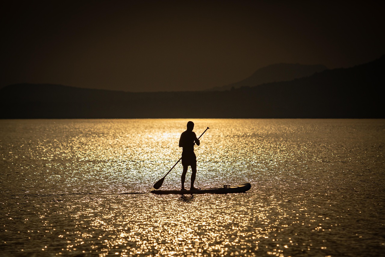 Man, lake, silhouette — Simplify Your Surf Trip with Costa Rica All Inclusive Surfing Packages