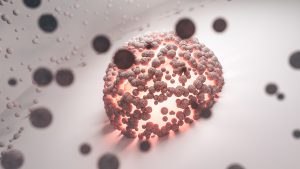 Abstract representation of stem cells in a glowing sphere surrounded by smaller particles